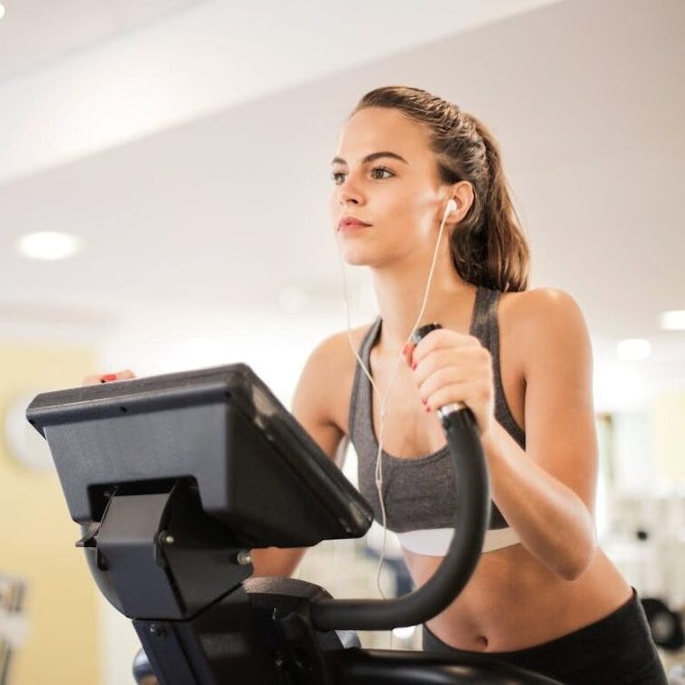 Photo Of Woman Using Earphones